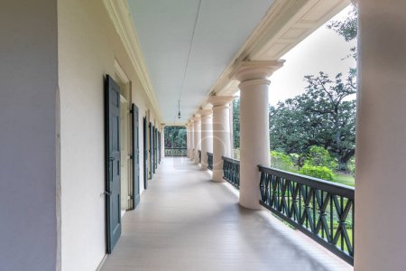 Photo for Vacherie, USA - October 27, 2023: balcony at oak alley Plantation in Vacherie, Texas. The plantation operated from operated from 1752-1975 and serves nowadays as a museum to show the history of slavery. - Royalty Free Image