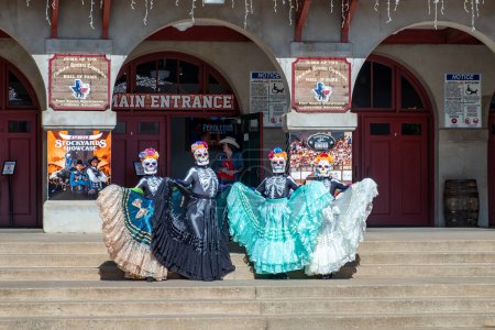 Photo for Fort Worth, Texas - November 5, 2023: mexican women pose for the day of the dead in western clothes at the stockyards in Fort Worth, Texas, USA.. - Royalty Free Image
