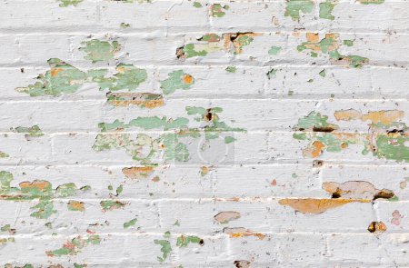 Photo for Old brick wall background with many layers ofin different color of old peeling paint - Royalty Free Image