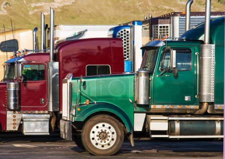 Photo for Two trucks in row at a parking lot at the highway in California, USA - Royalty Free Image