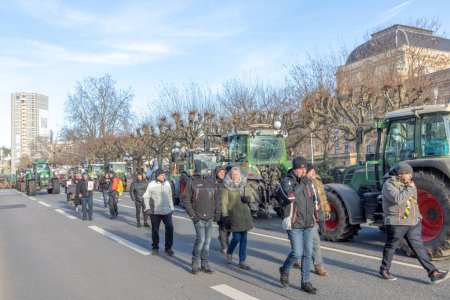 Photo for Wiesbaden, Germany - January 8, 2024: farmer with their tractors demonstrate for cutting down the price for diesel fuel and against the german government. - Royalty Free Image
