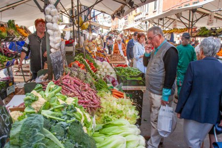 Photo for Venice, Italy - September 23, 2005: people enjoy buying fresh food at the farmers market in Venice, Italy. - Royalty Free Image
