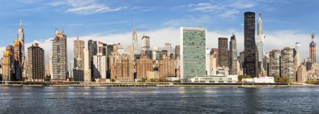 Photo for NEW YORK, USA - AUG 23, 2015: skyline of New York seen from east river. The East River is a salt water tidal strait in New York City. The waterway connects Upper New York Bay to Long Island Sound. - Royalty Free Image