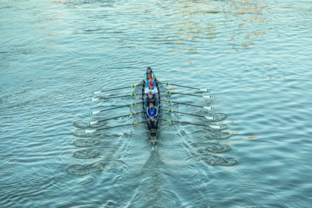 Photo for Aerial of rower in early morning at the river in an five people boat - Royalty Free Image