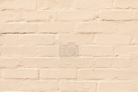 Téléchargez les photos : Fond de mur de brique ocre harmonique en détail - en image libre de droit