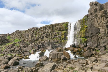 Beautiful Oxararfoss waterfall in summer, Thingvellir National Park in Iceland