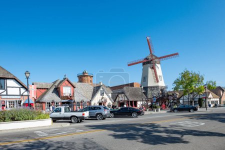 Photo for Solvang, California, USA - APRIL 22, 2019: old Main street in Solvang historic downtown with windmill in Santa Barbara County. The Danish Village is a popular tourist attraction. - Royalty Free Image