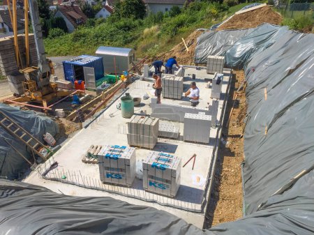 Photo for Ruppertshain, Germany - July 6, 2018: concrete walls to build a cellar at the construction site for a prefabricated family house.. - Royalty Free Image