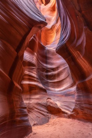 Cardiac slot canyon near Page Arizona highlights the narrow passageway and amazing, glowing light and intricate patterns that form over millions of years from the combination of water and sediment flow.