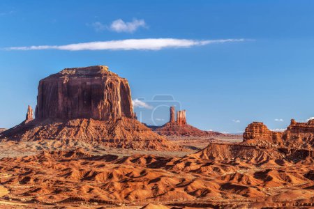 Sunrise in Monument Valley shows the spire and butte formations that evolved over time due to wind and water erosion.