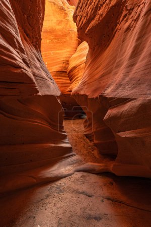 Antelope slot canyon near Page Arizona highlights the narrow passageway and amazing, glowing light and intricate patterns that form over millions of years from the combination of water and sediment flow.