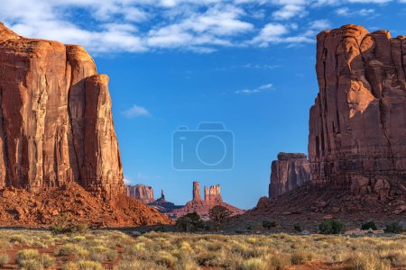 Sunrise in Monument Valley shows the spire and butte formations that evolved over time due to wind and water erosion.