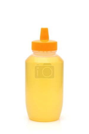 Foto de Botella de plástico de miel sobre fondo blanco - Imagen libre de derechos