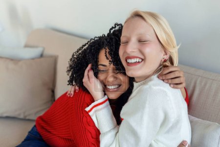 Photo for Candid diverse girls best friends embracing standing indoors, close up satisfied women face enjoy tender moment missed glad to see each other after long separation, friendship warm relations concept - Royalty Free Image