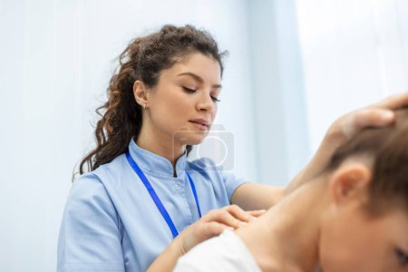 Photo for Physiotherapist doing healing treatment on womans neck,Chiropractic adjustment, pain relief concept.office syndrome - Royalty Free Image