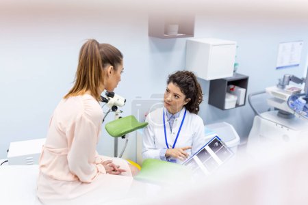 Photo for Gynecologist doctor and a patient on a gynecological chair. Preventive reception, preparation for medical examination, pregnancy management, health care gynecology contol - Royalty Free Image