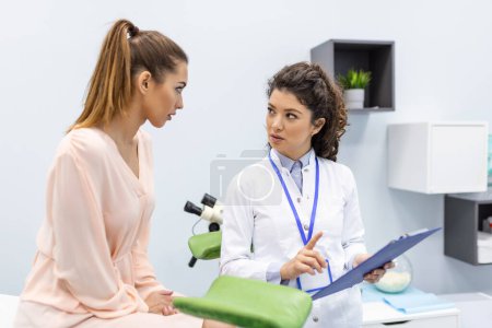 Photo for A gynecologist is examined by a patient who is sitting in a gynecological chair. Examination by a gynecologist. Female health concept. - Royalty Free Image