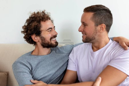 Photo for Two young man lgbtq gay couple dating in love hugging enjoying intimate tender sensual moment together kissing with eyes closed - Royalty Free Image