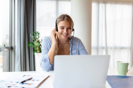 Photo for Young friendly operator woman agent with headsets. Beautiful business woman wearing microphone headset working in the office as a telemarketing customer service agent, call center job concept. - Royalty Free Image