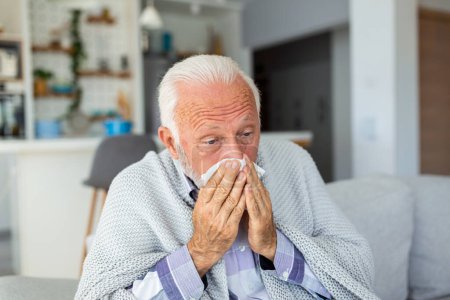 Photo for New coronavirus CoVid-19 outbreak situation with pandemic epidemic warning - adult caucasian senior old man with fever symptoms like illness cold seasonal influenza - people and virus concept - Royalty Free Image