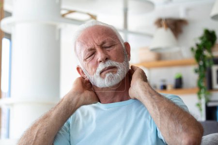 Photo for Senior elderly man touching his neck, suffering from neck pain, sciatica, sedentary lifestyle concept. neck health problems. Healthcare, insurance - Royalty Free Image