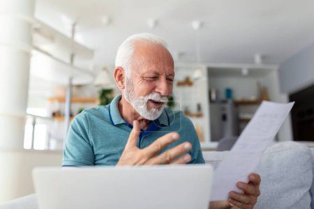 Photo for Surprised laughing happy old mature retired man looking through paper document, feeling excited analyzing financial information, getting taxes refund or bank loan approval at home. - Royalty Free Image