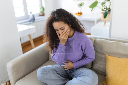 Photo for Closeup portrait of Asian unhappy, annoyed, sick woman about to chuck, throw up, puke retch barf. Negative emotions, feelings, facial expressions. Asian woman with morning sickness. - Royalty Free Image