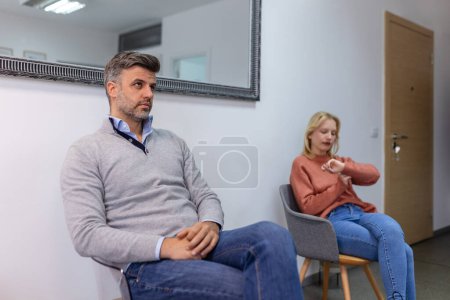 Photo for People sitting in row using smartphones, men and women waiting for job interview, human resources, employment or customers and electronic devices concept - Royalty Free Image