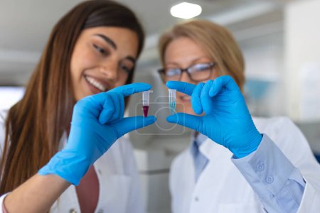 Photo for Scientist holding samples into tubes in research laboratory. Advanced Scientific Lab for Medicine, Biotechnology, Microbiology Development - Royalty Free Image