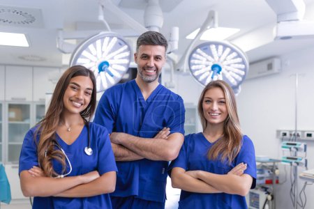 Photo for Medical professionals standing together. concept of health protection. Successful team of medical doctors are looking at camera and smiling while standing in hospital - Royalty Free Image