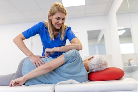 Photo for Senior woman having chiropractic back adjustment. Osteopathy, Alternative medicine, pain relief concept. Physiotherapy, injury rehabilitation - Royalty Free Image