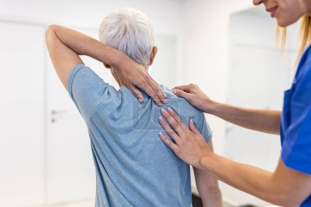 Photo for Physiotherapist doing healing treatment on woman's back. Back pain patient, treatment, Doctor consulting with patient Back problems Physical therapy concept - Royalty Free Image