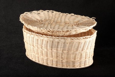Photo for Knitted basket with lid on black background - Royalty Free Image