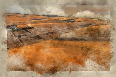 Foto de Digitally created watercolour painting of Stunning aerial drone landscape image of golden hour over farmers fields in South Downs National Park in England during Summer dawn - Imagen libre de derechos