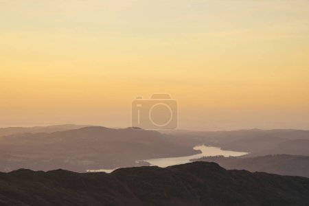 Foto de Beautiful Winter dawn landscape view from Red Screes in Lake District looking South towards Windermere with colorful vibrant sky - Imagen libre de derechos