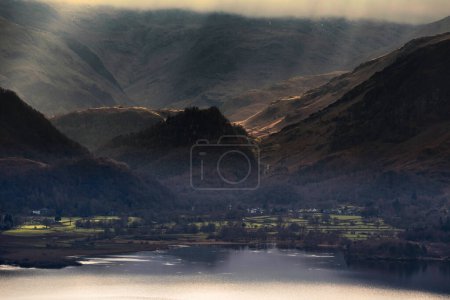 Photo for Beautiful early Winter morning landscape view from Latrigg Fell in Lake District along Derwentwater to  Castle Crag and beautiful sunbeams - Royalty Free Image