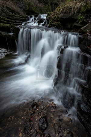 Foto de Beautiful peaceful landscape image of Scaleber Force waterfall in Yorkshire Dales in England during Winter morning - Imagen libre de derechos