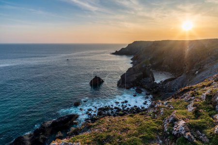 Photo for Stunning sunrise and sunset landscape image of popular tourist l;ocation at Kynance Cove in Cornwall England with colourful sky - Royalty Free Image