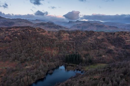 Stunning aerial drone landscape image of Lake District during Spring vibrant sunset