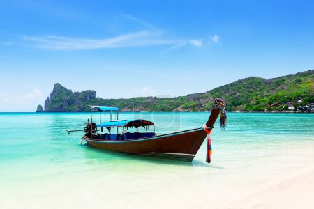 Photo for Thai traditional wooden longtail boat and beautiful sand beach at Koh Phi Phi island in Krabi province. Ao Nang, Thailand. Longtail boat and tropical beach in Andaman Sea, Thailand. - Royalty Free Image