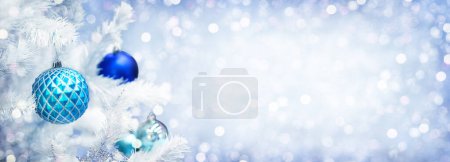 Photo for Christmas and New Year holiday background with copy space for your text. Winter Christmas decoration with fir tree, garland lights. Holiday festive background. - Royalty Free Image