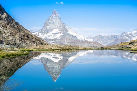 Photo for Matterhorn reflection in Riffelsee on a summer day, Zermatt, Switzerland - Royalty Free Image