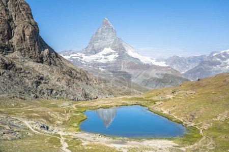 Téléchargez les photos : Matterhorn reflection in Riffelsee on a summer day, Zermatt, Switzerland - en image libre de droit