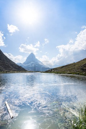 Photo for Matterhorn reflection in Riffelsee on a summer day, Zermatt, Switzerland - Royalty Free Image