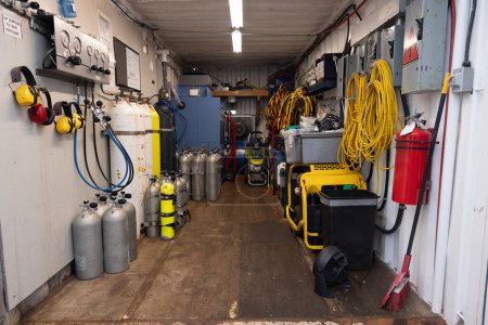 Commercial diving gear organized in container angle shot
