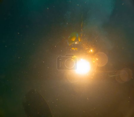 Underwater oxy-fuel in deep ocean depths closeup