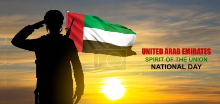 Foto de Silhouette of a saluting soldier on background of the sunrise and UAE flag. Concept for Commemoration Day, Martyrs Day, National Day - Imagen libre de derechos