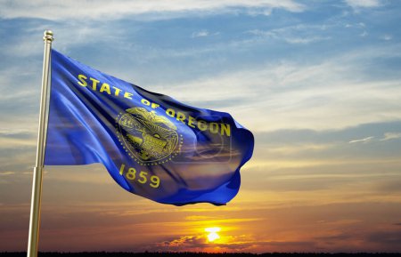 Flag of Oregon US state against the sunset. 3d-rendering