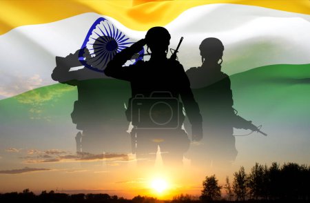 Silhouettes of soldiers against the sunset with India flag. Greeting card for National Holidays
