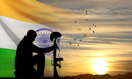 Foto de Silhouette of soldier kneeling down on a background of sunset and India flag. Greeting card for National Holidays. EPS10 vector - Imagen libre de derechos